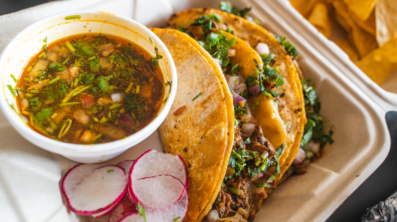 Birria tacos with consommé