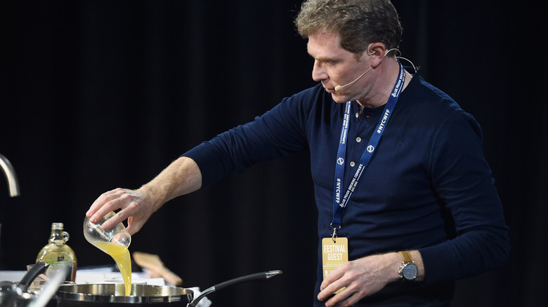 Bobby Flay cooking in kitchen