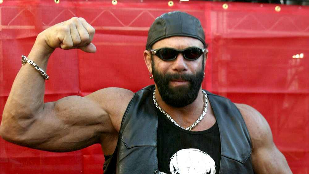 Macho Man Randy Savage flexing his bicep, 2003