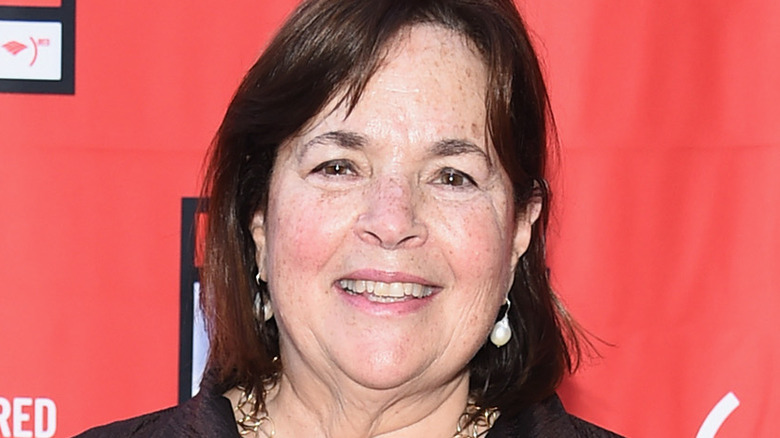 Ina Garten against red background