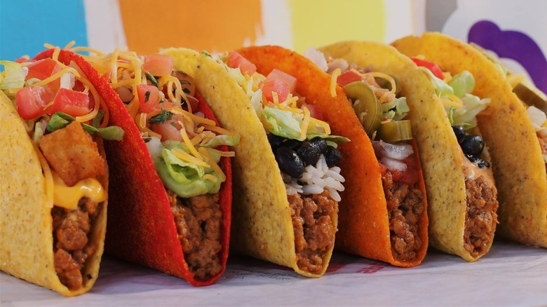 tacos filled with meat and salad