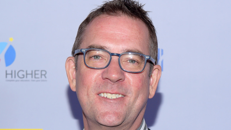 Ted Allen smiling in glasses