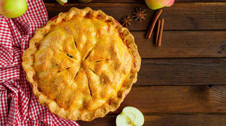 Apple pie on wooden board 