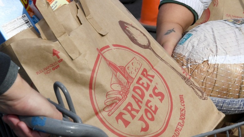 Trader Joe's brown bag in a grocery cart