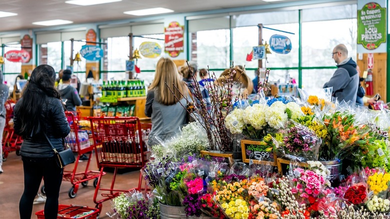 Trader Joe's shoppers and flowers