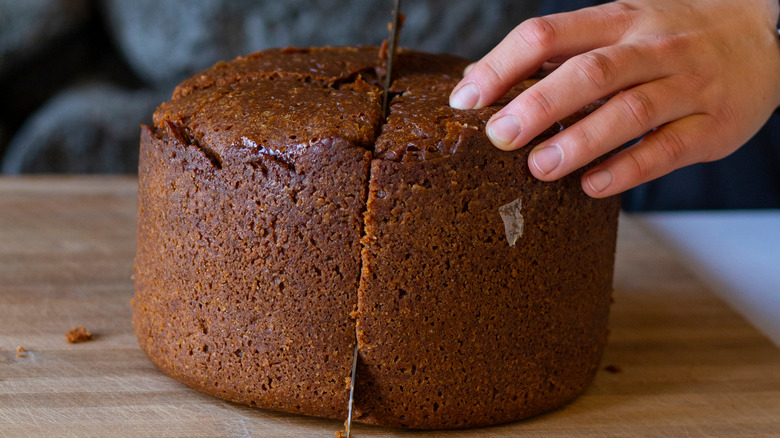 Knife slicing Icelandic earth-baked bread