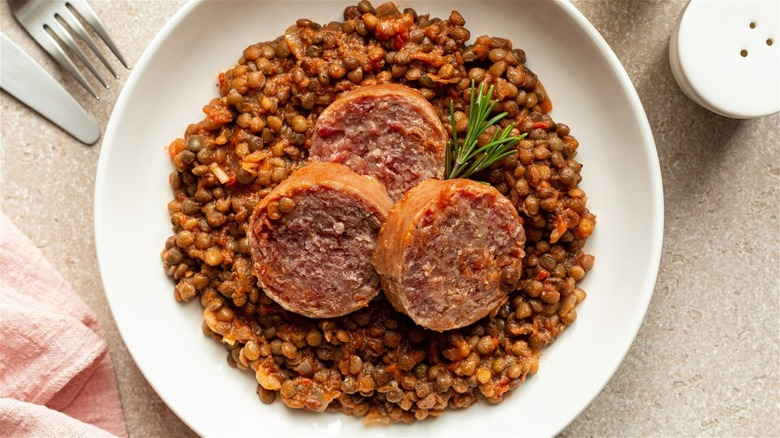 Italian cotechino sausage on lentils 