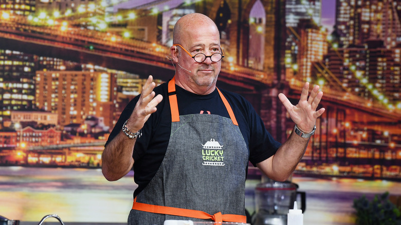Andrew Zimmern in an apron
