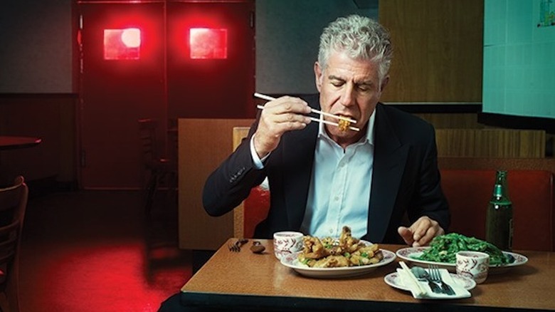 Chef and TV host Anthony Bourdain eating a meal