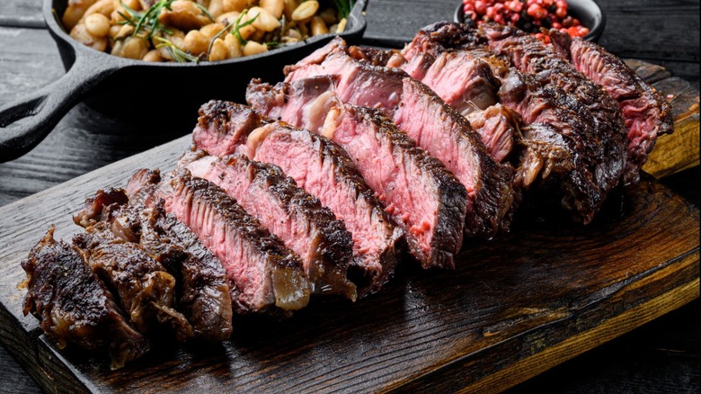 sliced beef on a cutting board