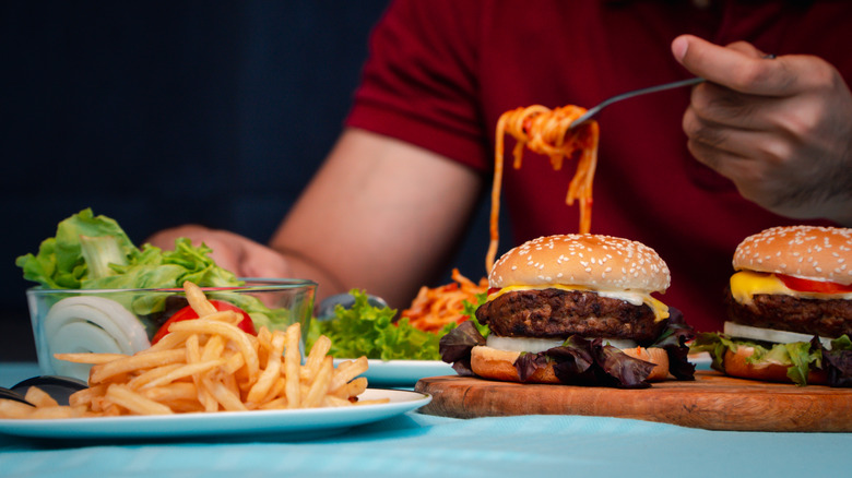 man with plate of diner food