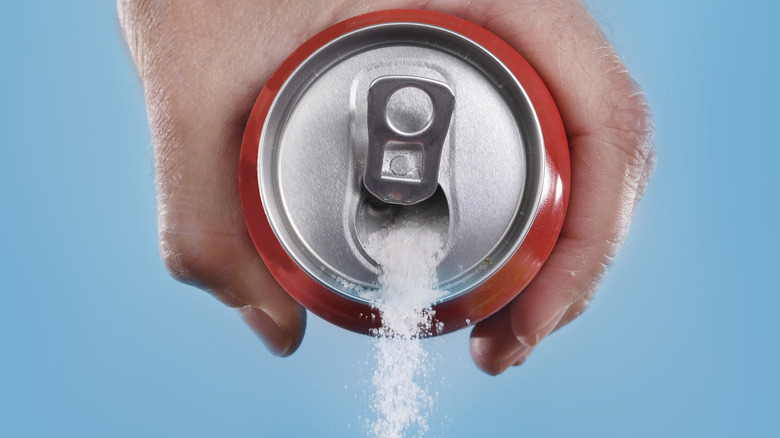 Sugar pouring out of soda can