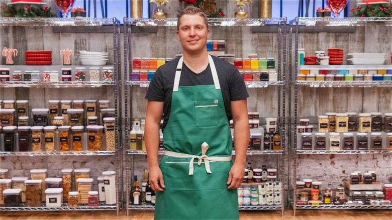 Chef Adam Monette in green apron