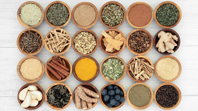 Small bowls of various adaptogenic herbs