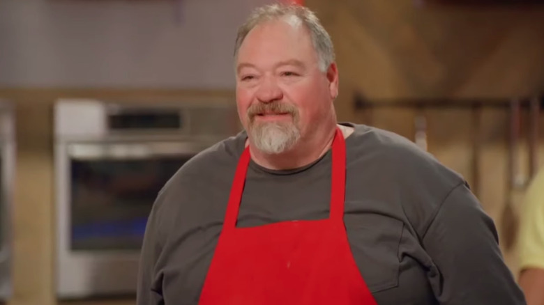 Al Kingswriter on Worst Cooks in America in red apron