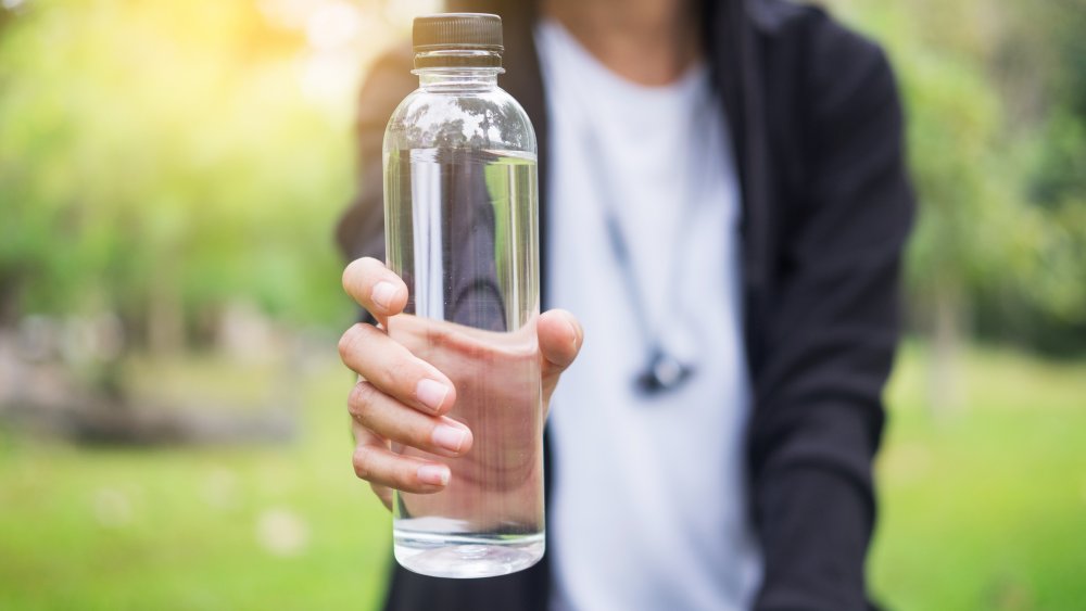 woman-holding-water-bottle