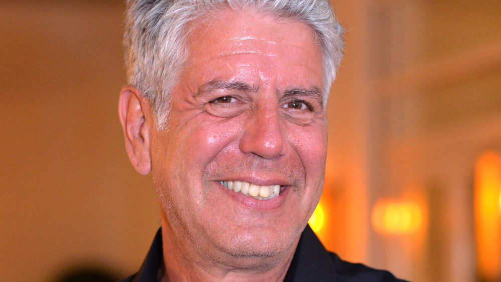 Anthony Bourdain smiling at pub