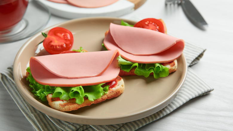 open face bologna sandwiches on plate