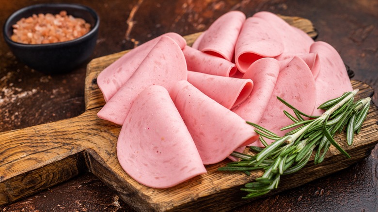 slices of bologna on cutting board