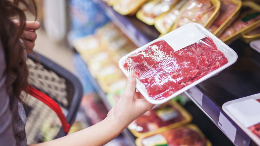 Woman holding packaged food
