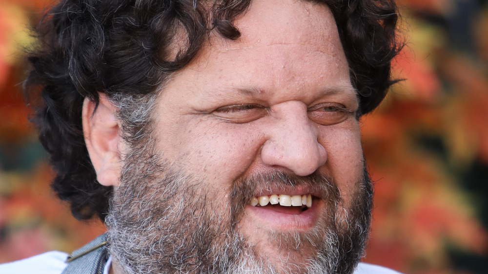 Chef Aaron May smiles