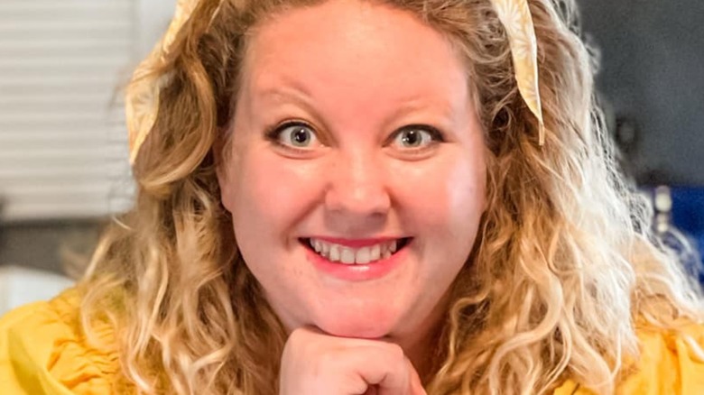 Cheyenne Loomis wearing a headband and smiling