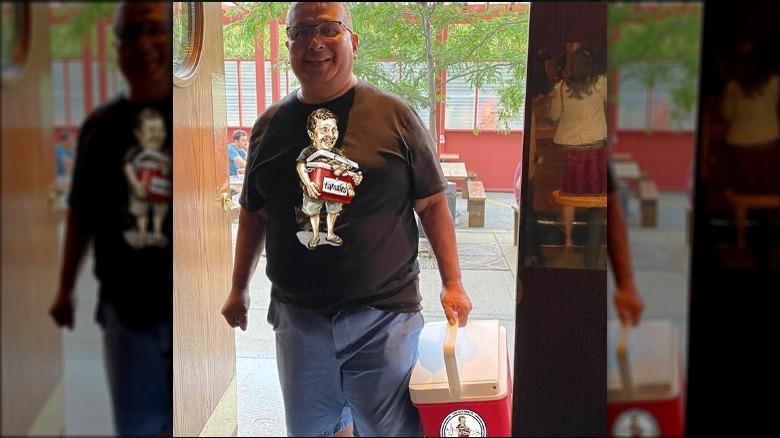 Claudio Velez with red cooler