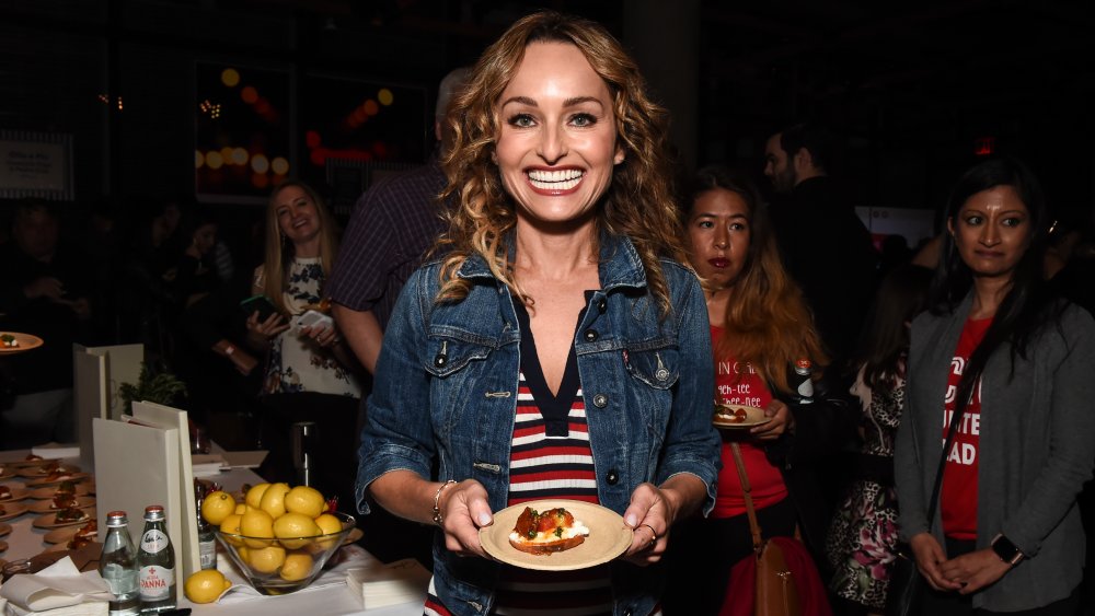 Giada de Laurentiis holding a plate of food