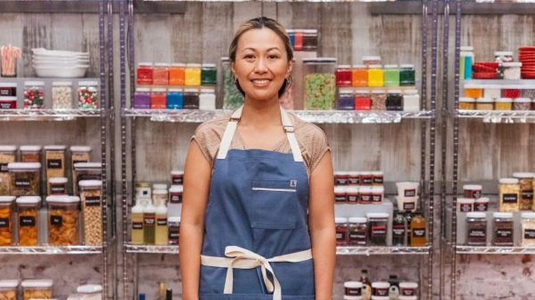 Grace Lapsys posing in front of cabinets