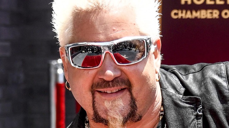 Guy Fieri posing in sunglasses