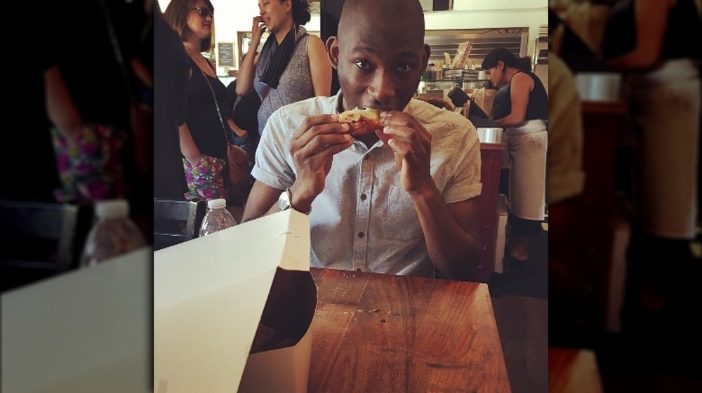 A shot of chef Jahmal Dailey eating