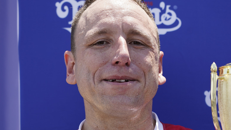 Joey Chestnut smiling and sweating