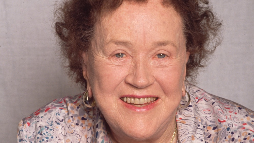 Julia Child smiling in pink lipstick