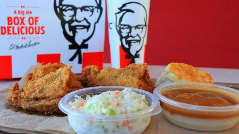 KFC meal in front of KFC cardboard box and drink cup 