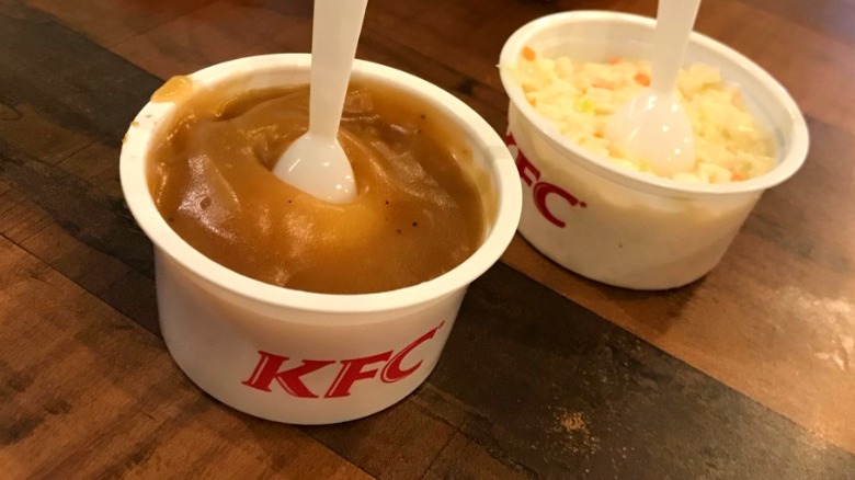 plastic bowls of KFC mashed potatoes and coleslaw