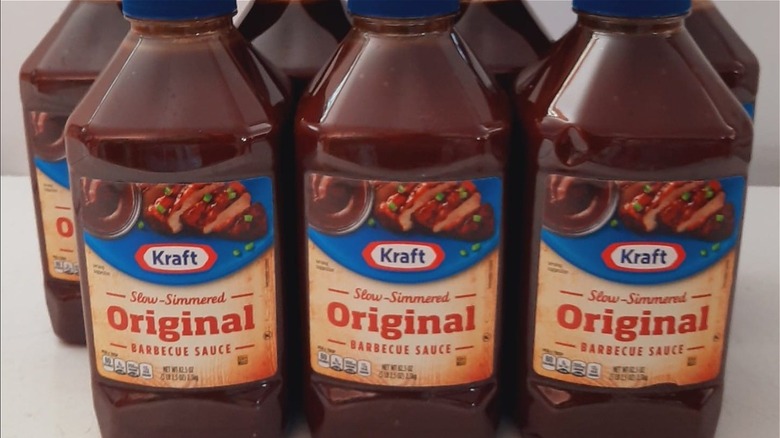 Bottles of Kraft BBQ sauce on shelf