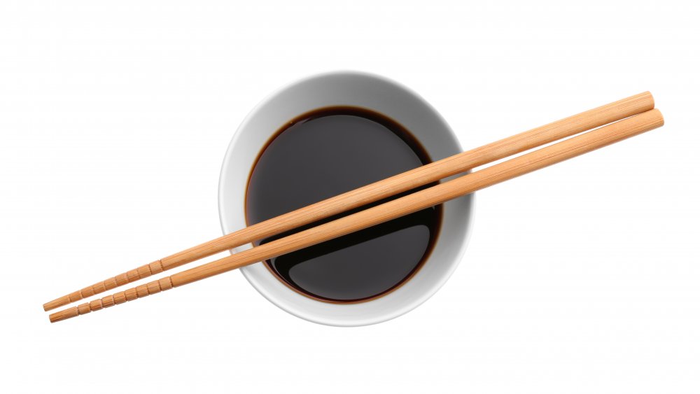 chopsticks on soy sauce bowl