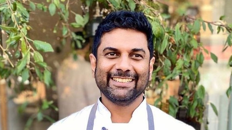 Chef Mohan smiling outdoors
