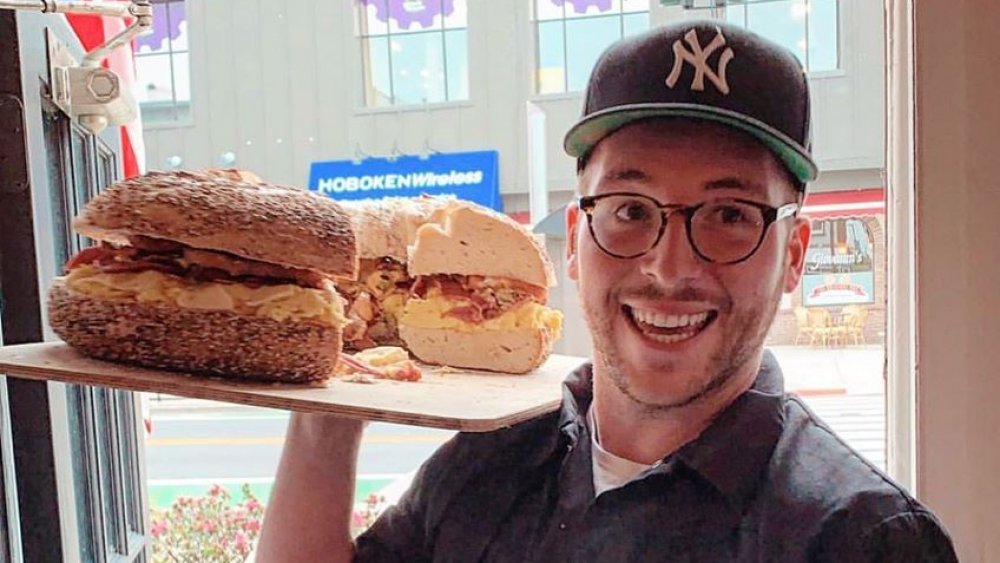 O'Bagel staffer with jumbo bagel