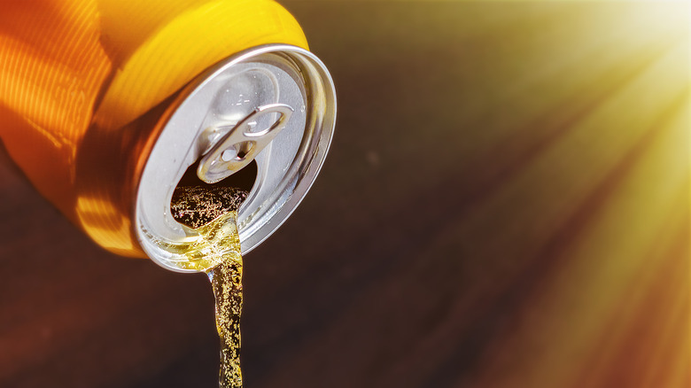 Close up of beer pouring out of can