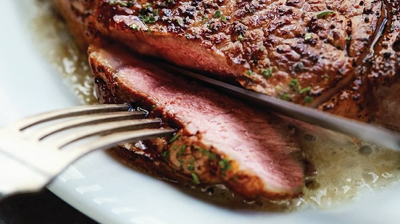 Cutting into Ruth's Chris' steak