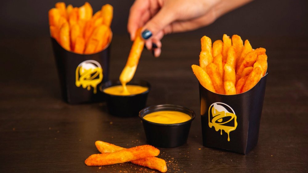 Nacho Fries dipped in cheese sauce