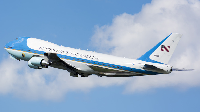 Air Force One flying across blue skies