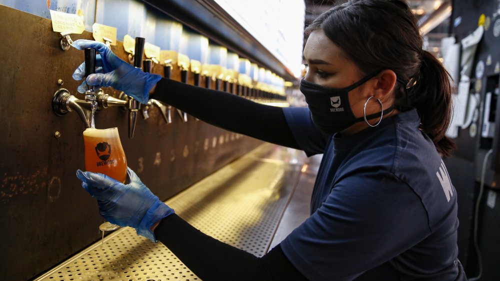 Bartender pouring a beer at a BrewDog pub