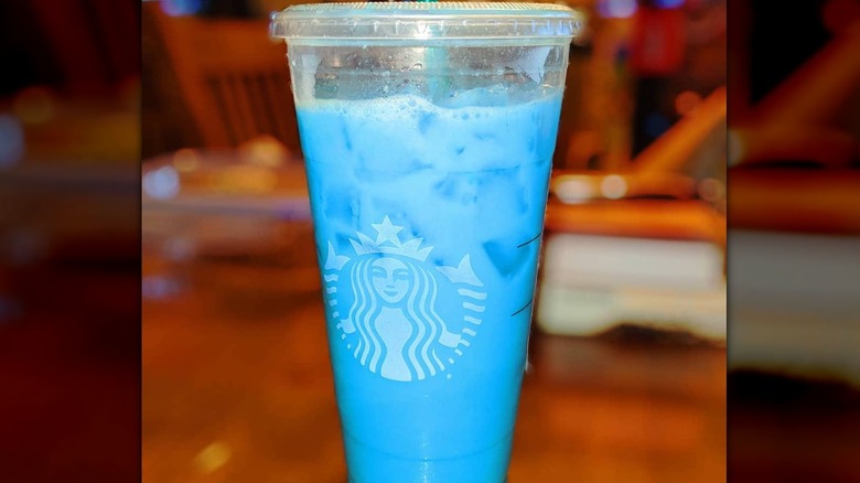 Starbucks cup with blue liquid inside