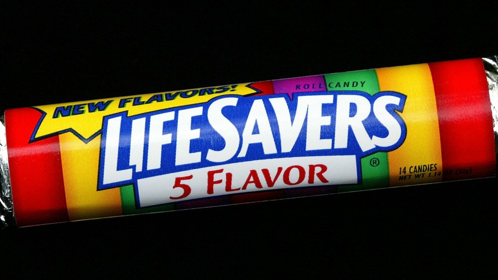 roll of Life Savers on black background