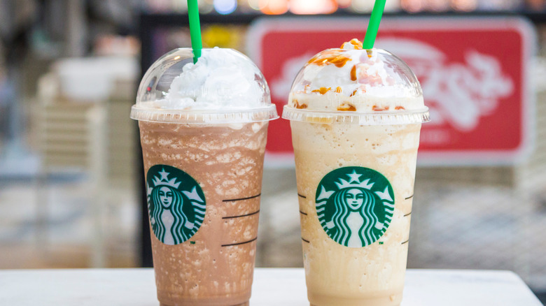 Two starbucks drinks on a table