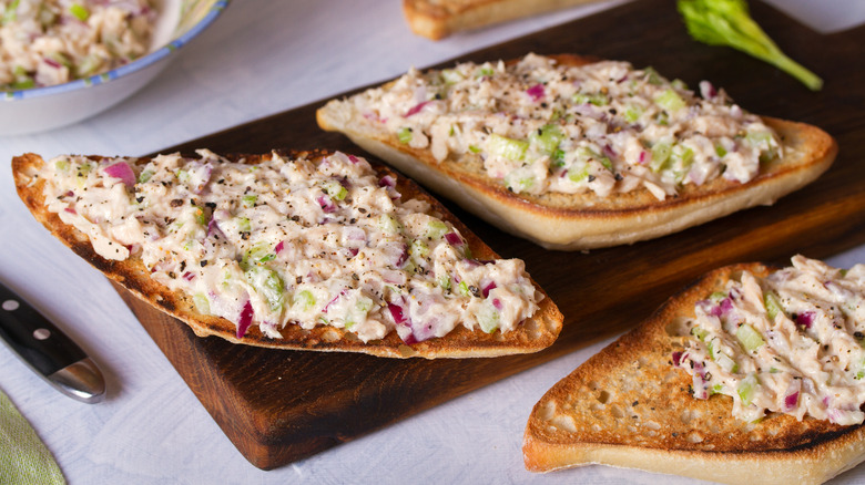 Tuna salad atop diamond-shaped slices of bread