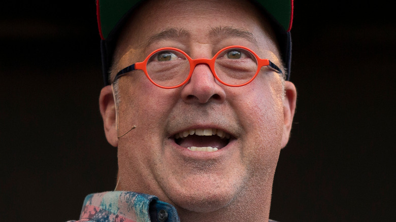 Andrew Zimmern orange glasses