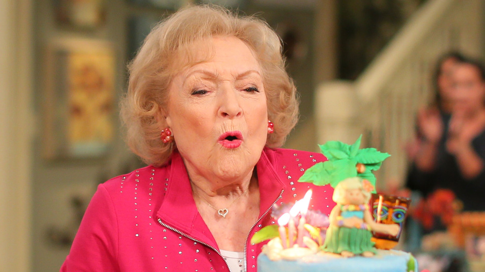 Betty White blowing out candles